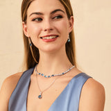 „Glamour Radiance“ – Tennis-Halskette aus Sterlingsilber mit Geburtsstein Dezember, ausgefallen geschliffenem blauem Topas und Geburtsstein Dezember