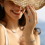 „Wisteria Whisper“ Flower Bar Armband aus blauem Topas und Silber