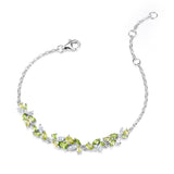 „Wisteria Whisper“ Flower Bar Peridot Silberarmband