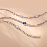 FANCIME „Axis“ Armband mit strahlend geschliffenem Saphir als Geburtsstein, Sterlingsilber und kubanischer Gliederkette