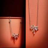 FANCIME „Satin Bow“ Halskette aus Sterlingsilber mit rosa Zirkonia 