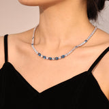 „Glamour Radiance“ – Tennis-Halskette aus Sterlingsilber mit Geburtsstein Dezember, ausgefallen geschliffenem blauem Topas und Geburtsstein Dezember