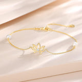 Luxuriöses, verstellbares Armband aus 14-karätigem Gelbgold mit Lotusblütenmotiv und 4 mm großen Süßwasserperlen – feinster Schmuck