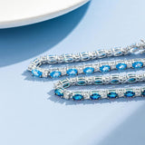 Armband „Glamour Radiance“ mit Geburtsstein Dezember, ausgefallen geschliffenem Tennis-Blautopas, Sterlingsilber 